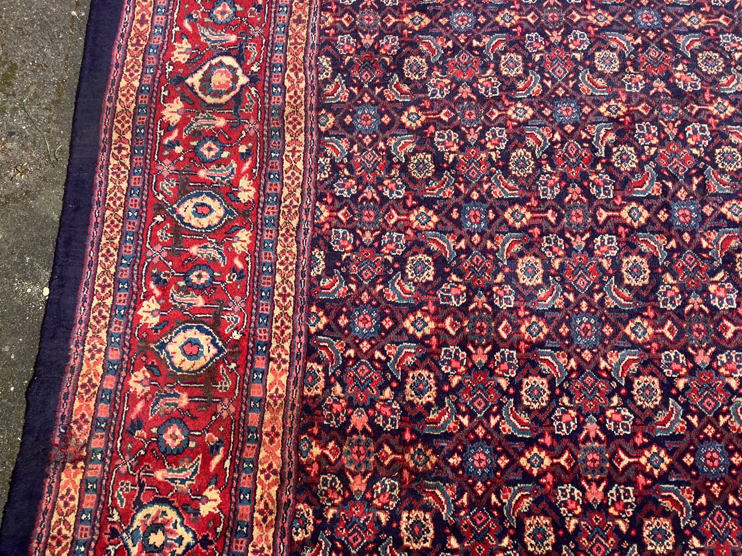 A North West Persian blue ground carpet, 534 x 325cm